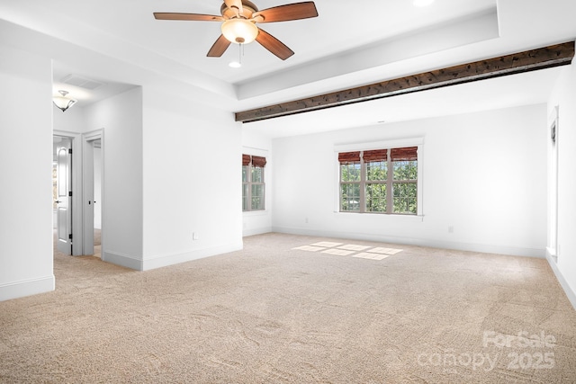 spare room with baseboards, a ceiling fan, carpet, and visible vents