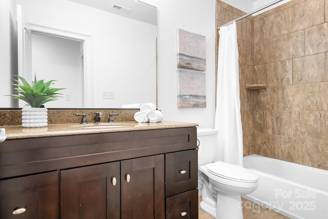 bathroom featuring shower / bath combination with curtain, visible vents, tile patterned flooring, vanity, and toilet
