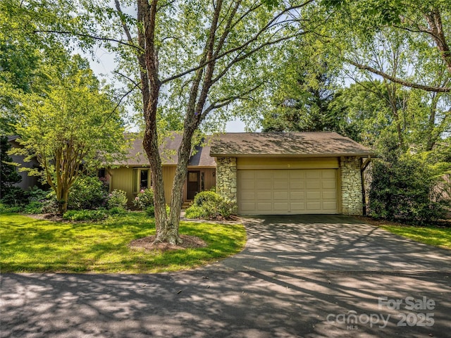 3 Governors Dr, Asheville, NC 28804 - view of front of house with an attached garage, a front lawn, driveway, and stone siding