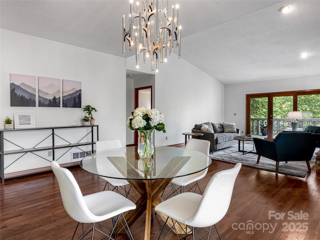 3 Governors Dr, Asheville, NC 28804 - dining space with a textured ceiling, wood finished floors, and vaulted ceiling