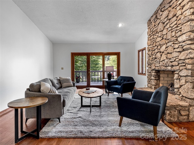 3 Governors Dr, Asheville, NC 28804 - living room featuring a fireplace, a textured ceiling, and wood finished floors