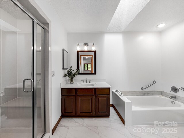 3 Governors Dr, Asheville, NC 28804 - bathroom with vanity, a textured ceiling, marble finish floor, a garden tub, and a stall shower