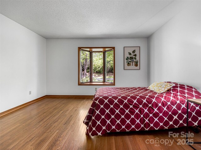 3 Governors Dr, Asheville, NC 28804 - bedroom with baseboards and hardwood / wood-style floors