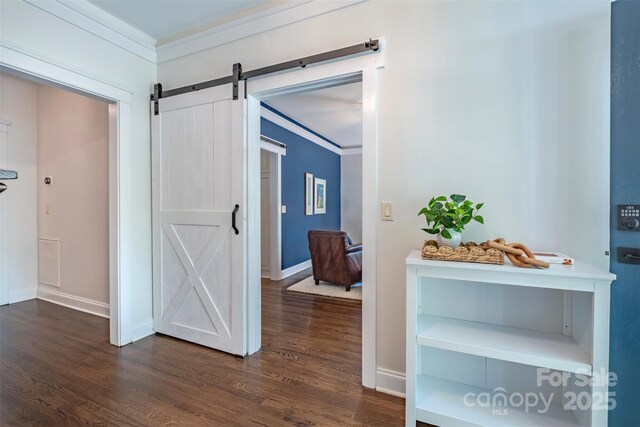 7409 Gilderstern Glen Ct, Huntersville, NC 28078 - hall with crown molding, dark wood-style flooring, baseboards, and a barn door