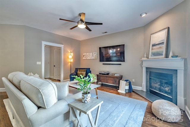 7409 Gilderstern Glen Ct, Huntersville, NC 28078 - living area with baseboards, a glass covered fireplace, ceiling fan, and wood finished floors