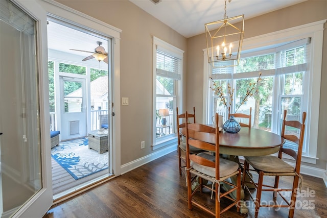 7409 Gilderstern Glen Ct, Huntersville, NC 28078 - dining space with plenty of natural light, dark wood finished floors, baseboards, and a notable chandelier