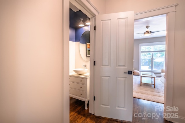 7409 Gilderstern Glen Ct, Huntersville, NC 28078 - hallway with a sink and dark wood-type flooring