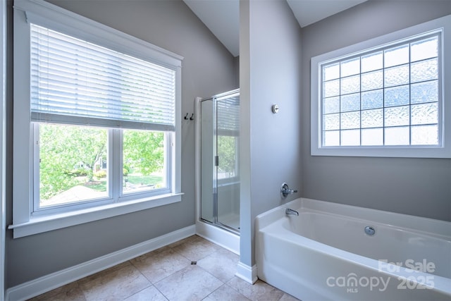 7409 Gilderstern Glen Ct, Huntersville, NC 28078 - bathroom featuring a garden tub, baseboards, tile patterned floors, and a shower stall