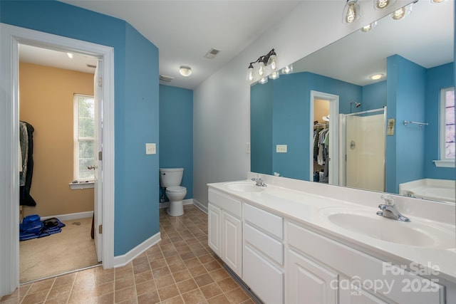 full bathroom featuring visible vents, a sink, a shower, and toilet