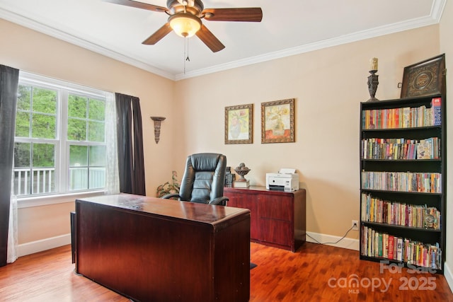 home office with baseboards, ceiling fan, ornamental molding, and wood finished floors