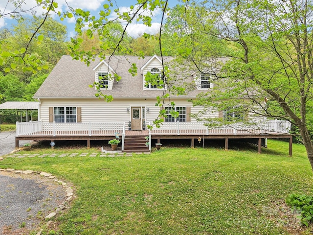 back of house featuring a wooden deck and a yard