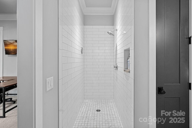 bathroom featuring crown molding and a stall shower