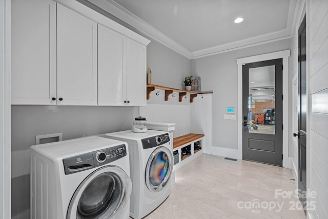 laundry area featuring cabinet space, recessed lighting, ornamental molding, and separate washer and dryer