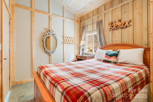 bedroom featuring wood ceiling, baseboards, lofted ceiling, and carpet