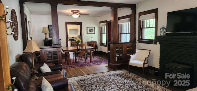 49 Euclid Blvd, Asheville, NC 28806 - living room featuring ornate columns, wood finished floors, ceiling fan, and baseboards