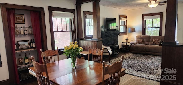 49 Euclid Blvd, Asheville, NC 28806 - dining space featuring decorative columns, wood finished floors, and a ceiling fan