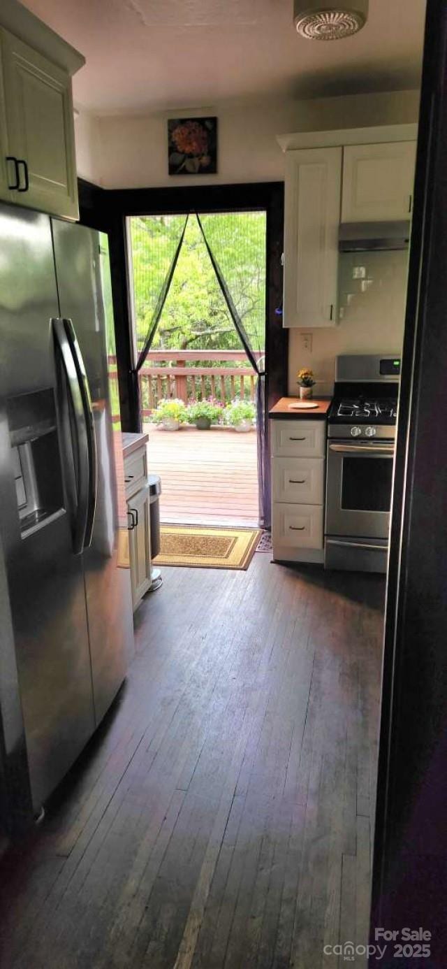 49 Euclid Blvd, Asheville, NC 28806 - kitchen with appliances with stainless steel finishes, dark wood finished floors, white cabinetry, and under cabinet range hood