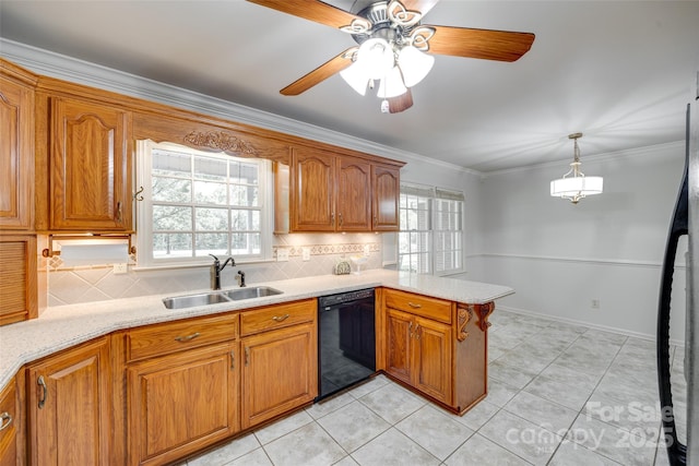 kitchen featuring dishwasher, a sink, a peninsula, brown cabinetry, and ornamental molding
