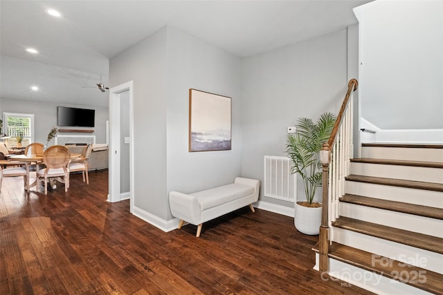 stairs featuring hardwood / wood-style floors, visible vents, and recessed lighting