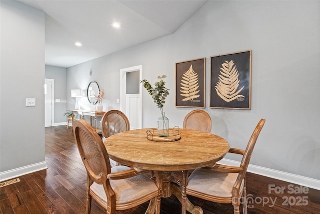 dining space with dark wood-style floors, baseboards, visible vents, and recessed lighting
