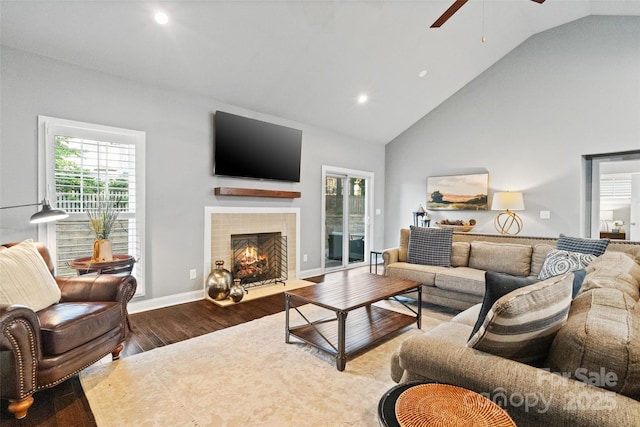 living room featuring plenty of natural light, a ceiling fan, wood finished floors, and recessed lighting
