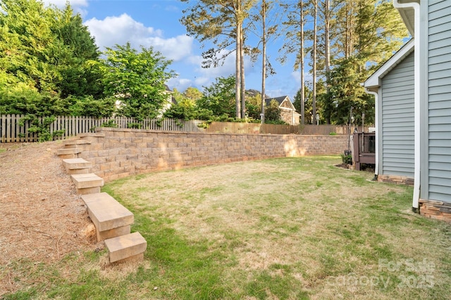 view of yard with a fenced backyard