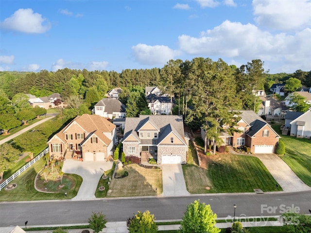 bird's eye view with a residential view and a view of trees