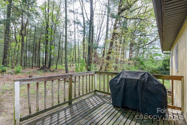wooden deck featuring area for grilling