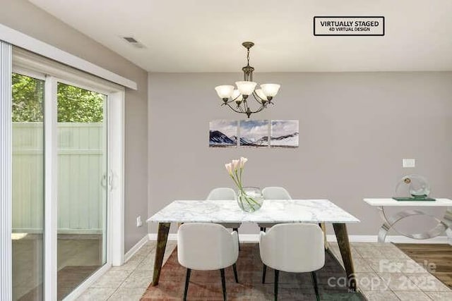 43 Sunny Meadows Blvd, Arden, NC 28704 - dining area featuring a chandelier, baseboards, and light tile patterned floors