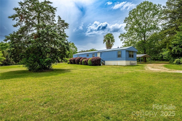 view of yard with a carport