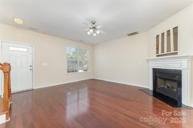 827 Gentlewinds Ct, Fort Mill, SC 29708 - unfurnished living room featuring visible vents, wood finished floors, a fireplace, baseboards, and ceiling fan