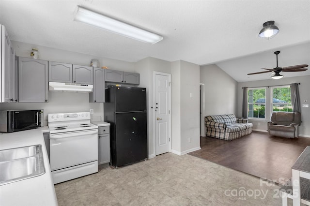 kitchen featuring a ceiling fan, gray cabinets, light floors, under cabinet range hood, and black appliances