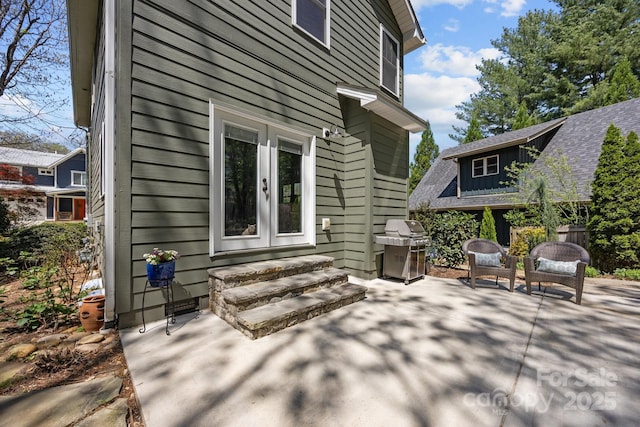 view of home's exterior featuring a patio area and french doors