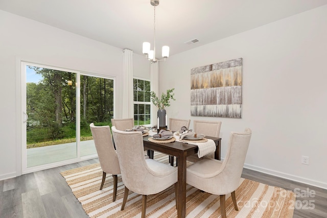 601 Westway Dr, Gastonia, NC 28054 - dining room with baseboards, a chandelier, wood finished floors, and visible vents