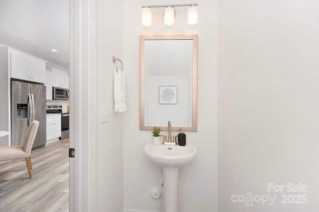 601 Westway Dr, Gastonia, NC 28054 - bathroom with baseboards, recessed lighting, and wood finished floors