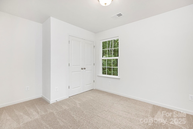 601 Westway Dr, Gastonia, NC 28054 - spare room with visible vents, baseboards, and light carpet