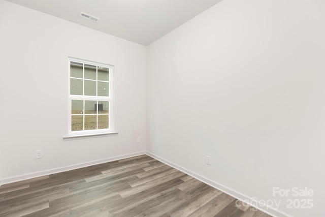 601 Westway Dr, Gastonia, NC 28054 - empty room with baseboards, visible vents, and wood finished floors