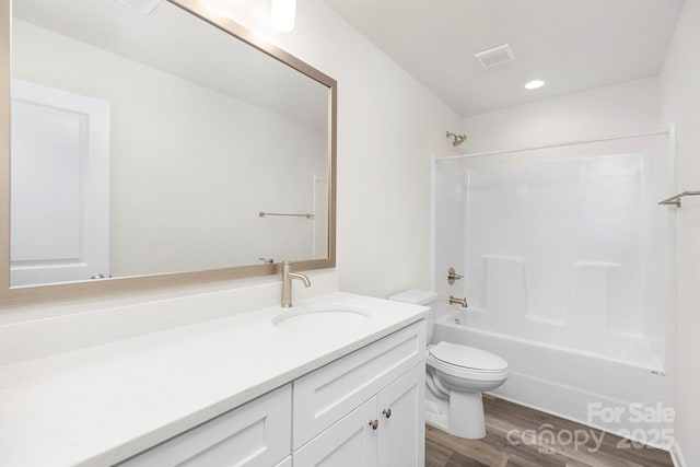601 Westway Dr, Gastonia, NC 28054 - full bath with toilet, shower / tub combination, wood finished floors, vanity, and visible vents