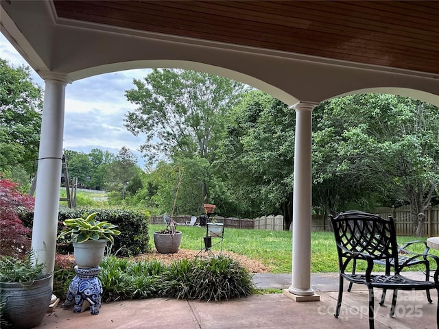 view of patio / terrace featuring fence
