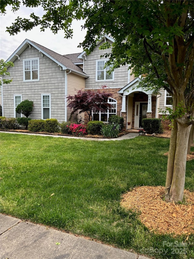 view of front of house with a front lawn
