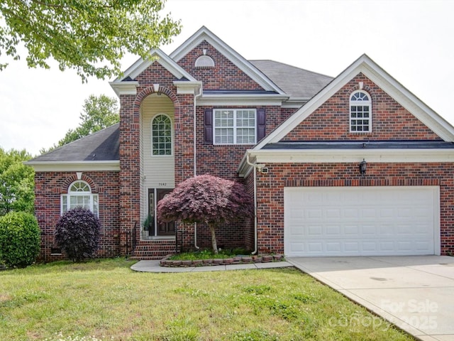 7642 Horseshoe Creek Dr, Huntersville, NC 28078 - traditional home featuring a front lawn, brick siding, driveway, and a garage