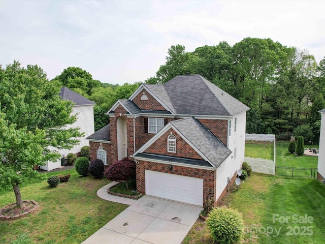 7642 Horseshoe Creek Dr, Huntersville, NC 28078 - traditional-style house with roof with shingles, a front lawn, concrete driveway, fence, and brick siding