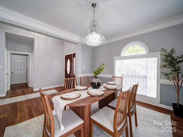 7642 Horseshoe Creek Dr, Huntersville, NC 28078 - dining area with wood finished floors, baseboards, a chandelier, and crown molding
