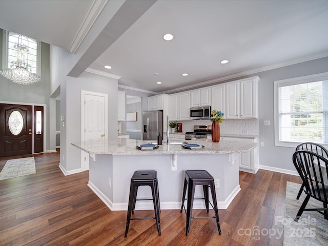 7642 Horseshoe Creek Dr, Huntersville, NC 28078 - kitchen featuring ornamental molding, white cabinetry, appliances with stainless steel finishes, and dark wood-style flooring