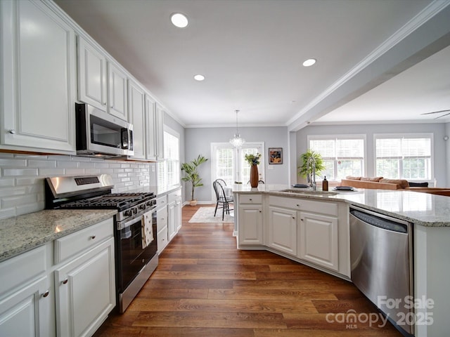 7642 Horseshoe Creek Dr, Huntersville, NC 28078 - kitchen featuring dark wood finished floors, backsplash, white cabinetry, light stone counters, and appliances with stainless steel finishes