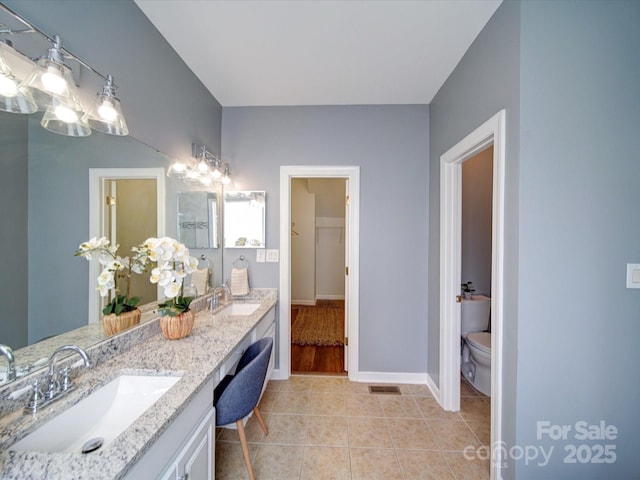 7642 Horseshoe Creek Dr, Huntersville, NC 28078 - full bathroom with double vanity, visible vents, tile patterned floors, and a sink