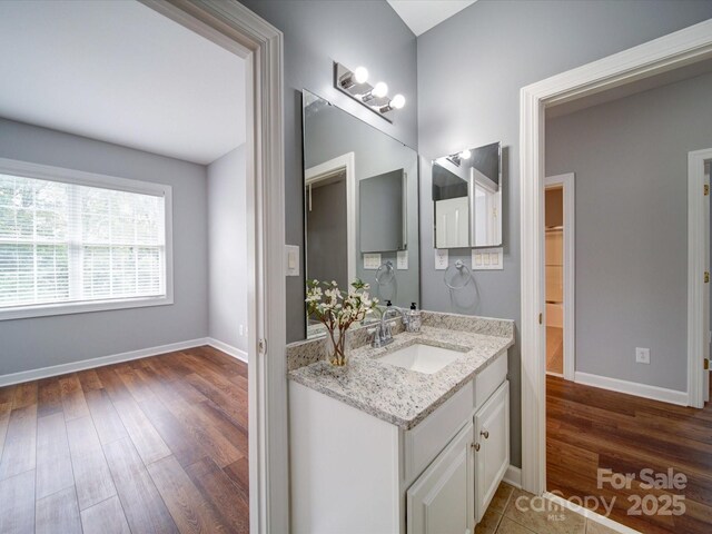 7642 Horseshoe Creek Dr, Huntersville, NC 28078 - bathroom featuring wood finished floors, vanity, and baseboards