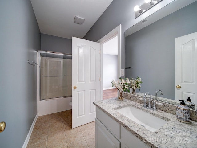 7642 Horseshoe Creek Dr, Huntersville, NC 28078 - full bathroom with shower / bath combination with glass door, tile patterned flooring, visible vents, vanity, and baseboards