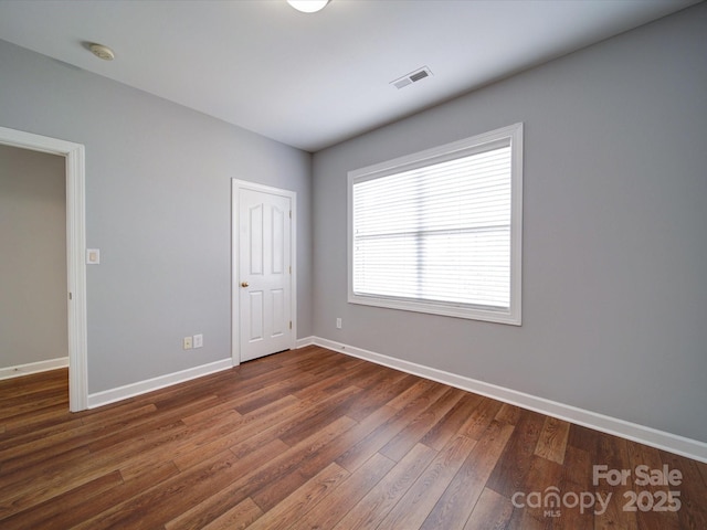 7642 Horseshoe Creek Dr, Huntersville, NC 28078 - unfurnished room with baseboards, visible vents, and dark wood finished floors