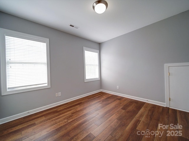 7642 Horseshoe Creek Dr, Huntersville, NC 28078 - unfurnished room with baseboards, visible vents, and dark wood finished floors